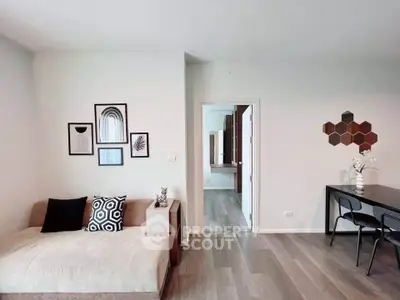 Modern living room with stylish decor and open layout, featuring a cozy sofa and elegant dining area.