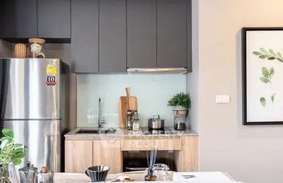 Modern kitchen with sleek cabinets and stainless steel appliances