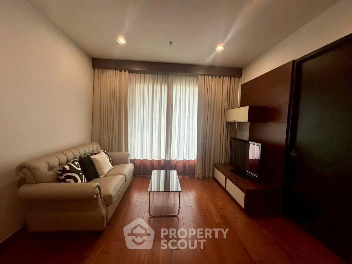 Cozy living room with elegant sofa and modern entertainment unit