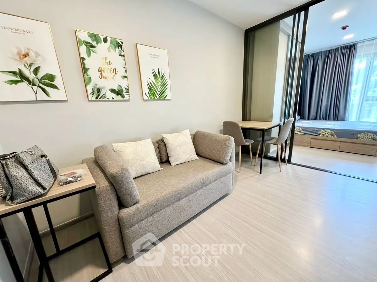 Modern living room with stylish decor and cozy seating in a contemporary apartment.