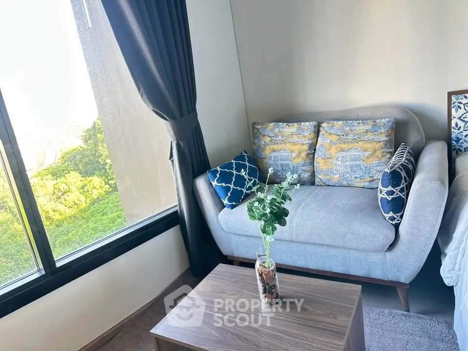 Cozy living room with stylish sofa and scenic window view