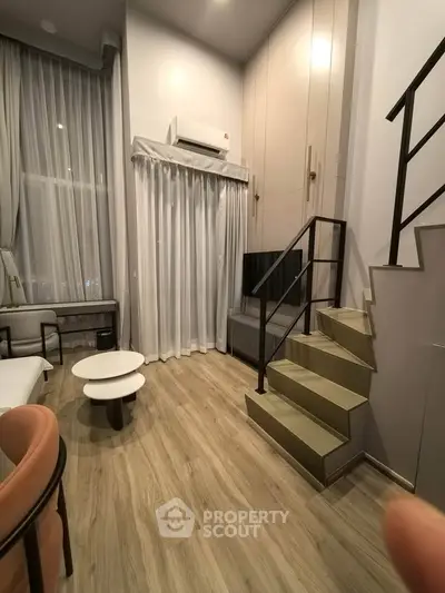 Modern duplex living room with high ceilings and stylish decor