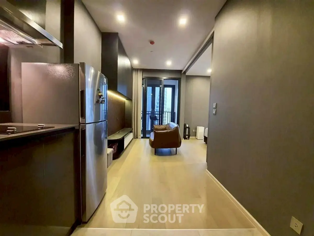 Modern apartment interior with sleek kitchen and cozy living area