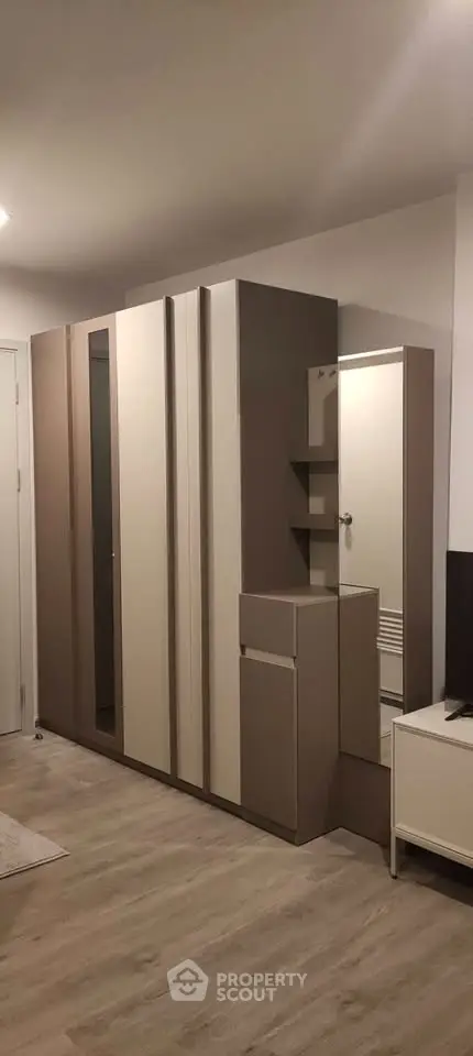 Modern bedroom with sleek wardrobe and minimalist design