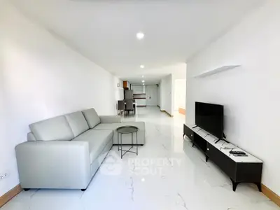 Spacious modern living room with sleek furniture and open layout