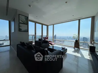 Luxurious living room with panoramic city views and modern furnishings