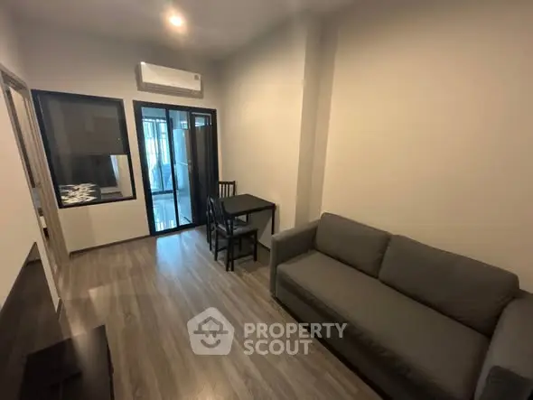 Modern living room with sleek design and cozy furniture in a stylish apartment.
