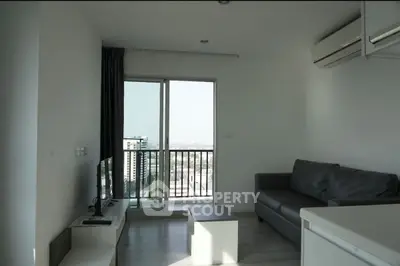 Modern living room with balcony view in high-rise apartment