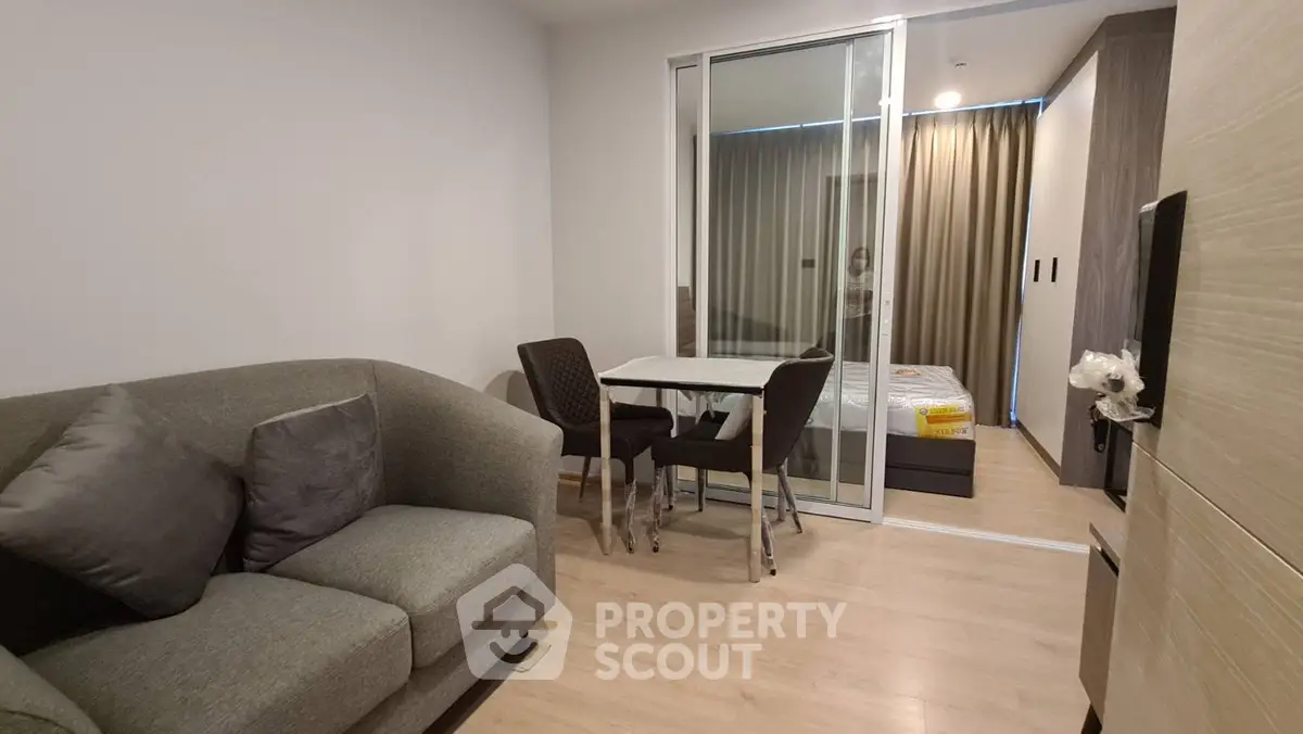 Modern apartment interior with cozy living room and bedroom view