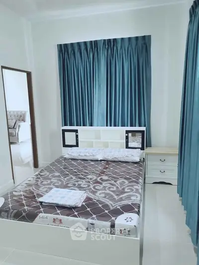 Cozy bedroom with elegant blue curtains and modern bed design