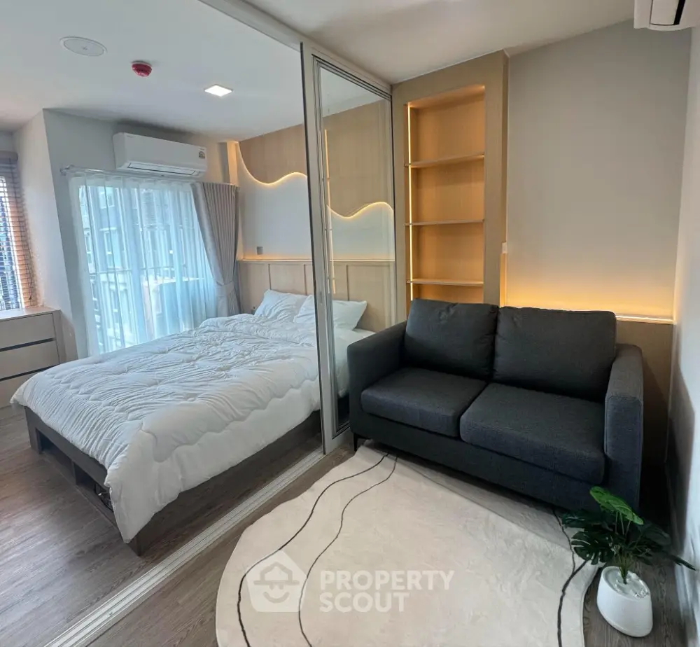 Modern studio apartment with cozy bedroom and stylish living area