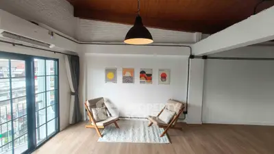 Stylish living room with modern decor and large windows offering natural light.