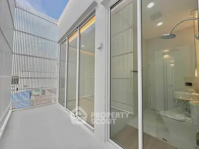 Modern balcony with sleek glass doors and stylish interior view