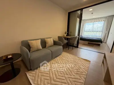 Modern open-plan living room with cozy seating and stylish decor