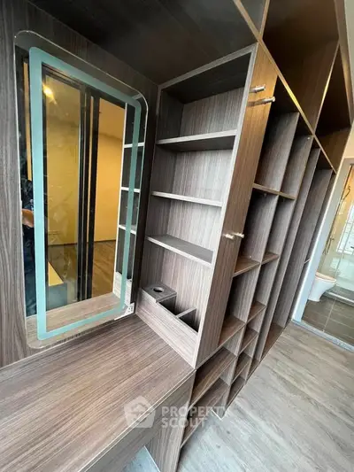 Luxurious walk-in closet with elegant wood finish and ample storage space