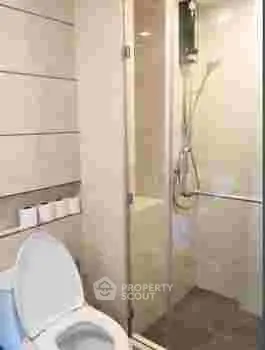Modern bathroom with glass shower and sleek toilet design