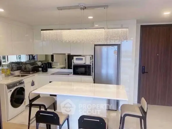 Modern kitchen with sleek appliances and stylish island seating