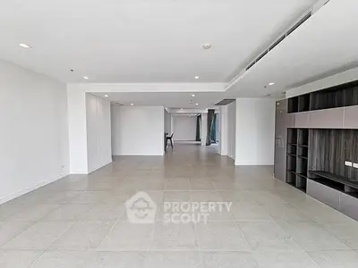 Spacious open-plan living area with modern design and ample natural light.