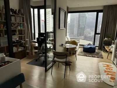 Modern apartment with city view, featuring open living space and stylish decor.