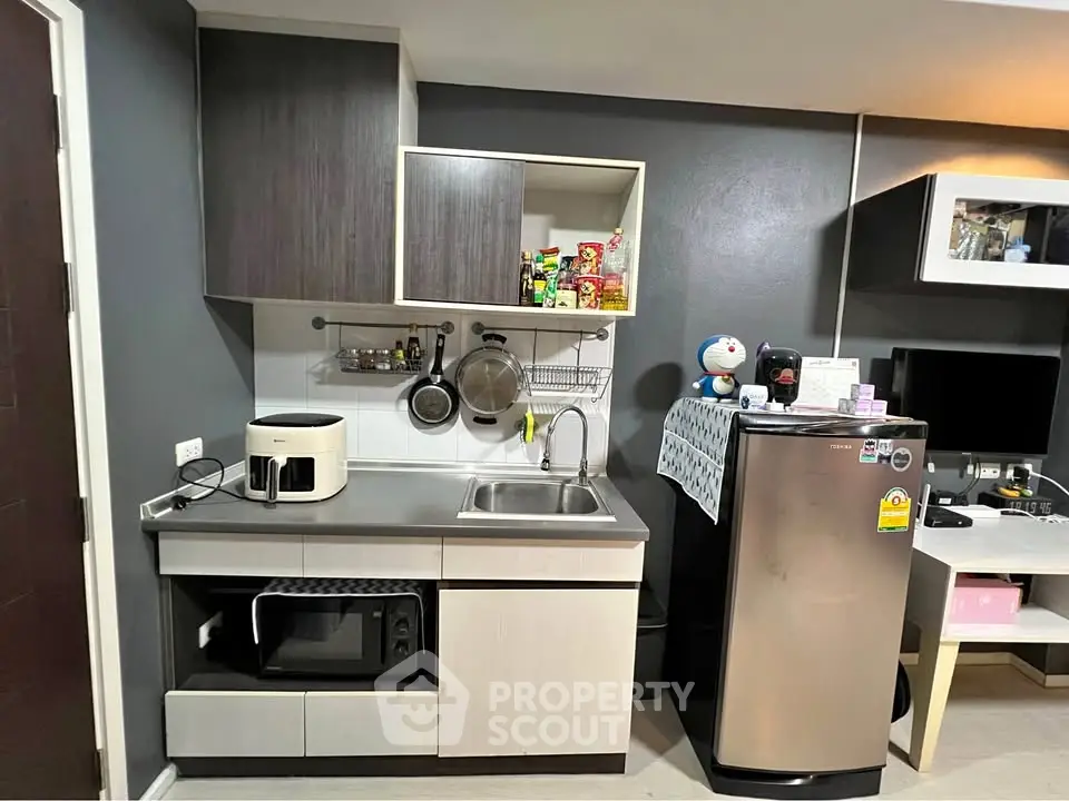Modern kitchen with sleek cabinets and stainless steel appliances