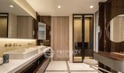 Luxurious modern bathroom with dual sinks and elegant wood accents