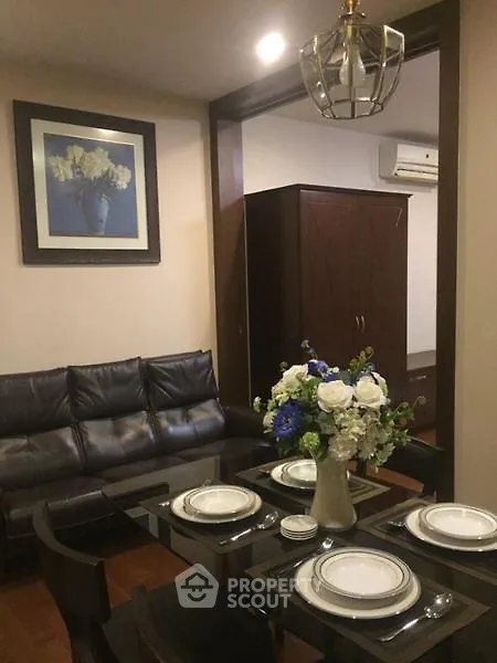 Elegant dining area with modern decor and cozy seating in a stylish apartment.