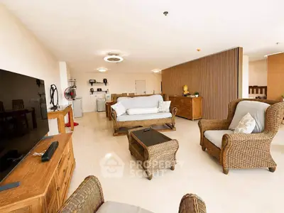 Spacious living room with elegant wicker furniture and modern decor