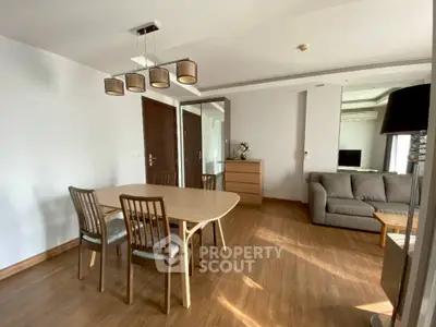 Spacious living room with modern furniture and wooden flooring