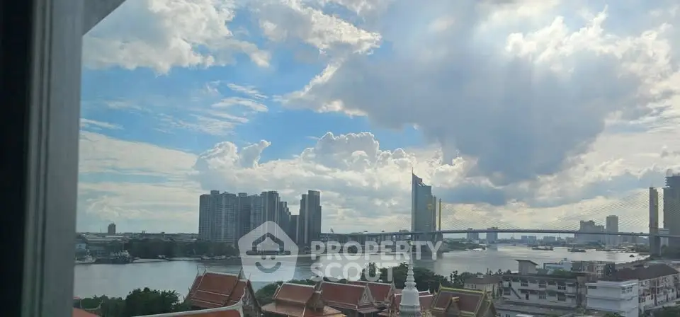 Stunning river view from high-rise apartment with city skyline and bridge