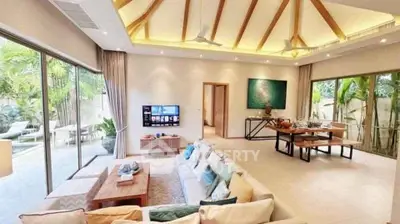 Luxurious open-plan living room with high ceilings and garden view, perfect for modern living.