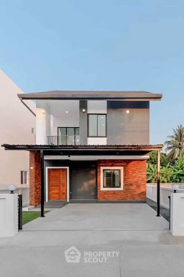 Modern two-story house with sleek design and spacious driveway