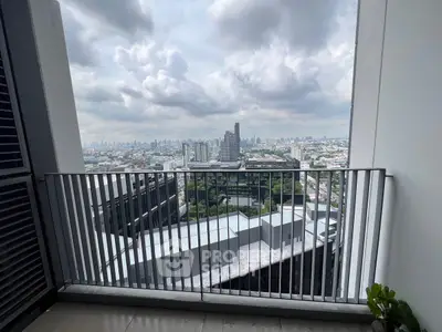 Stunning cityscape view from a modern balcony in a high-rise building.