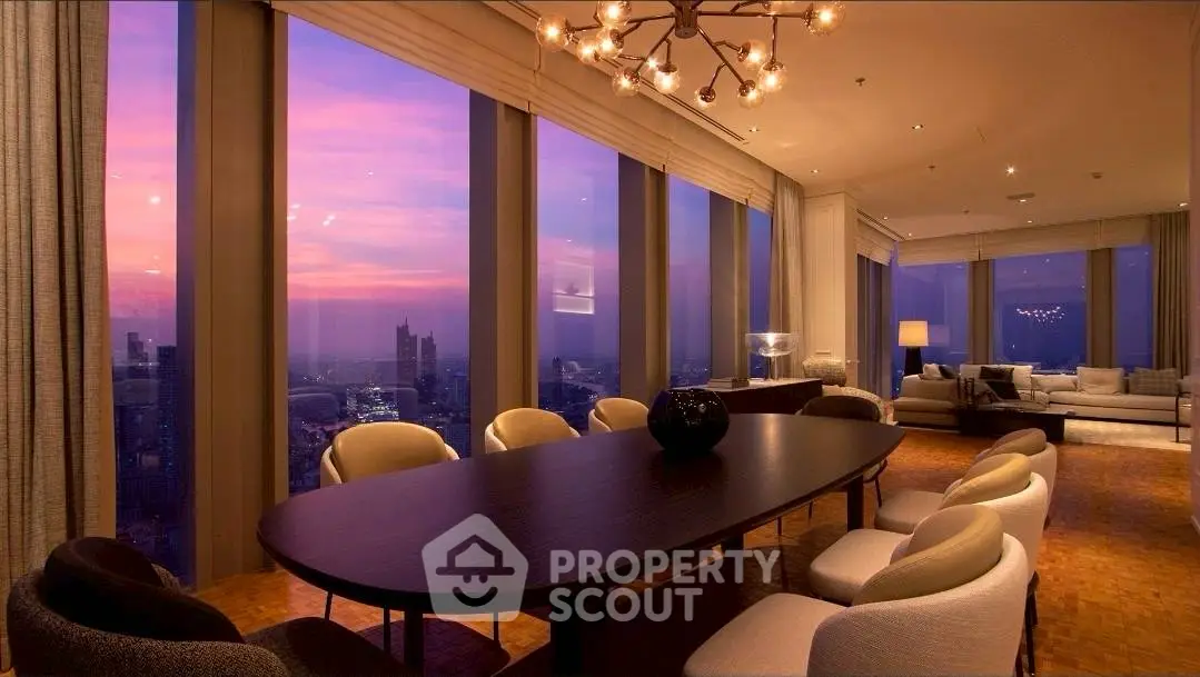 Luxurious high-rise living room with stunning sunset city views and elegant decor.