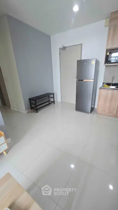 Modern kitchen with sleek fridge and minimalist design