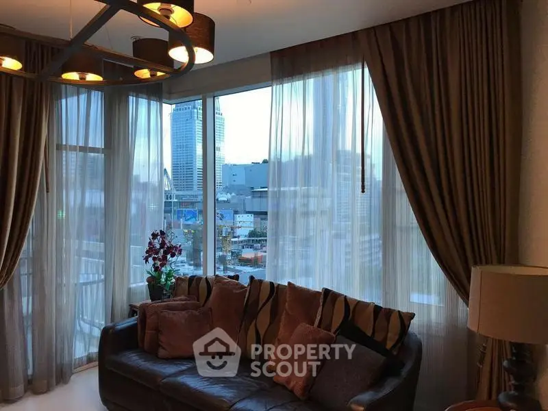 Luxurious living room with city view, elegant curtains, and stylish lighting.