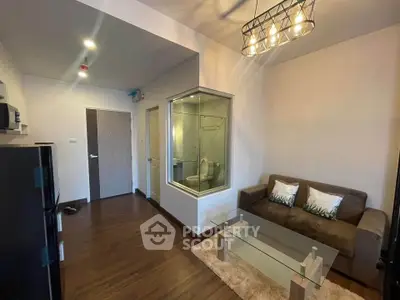 Modern living room with glass partition and stylish lighting