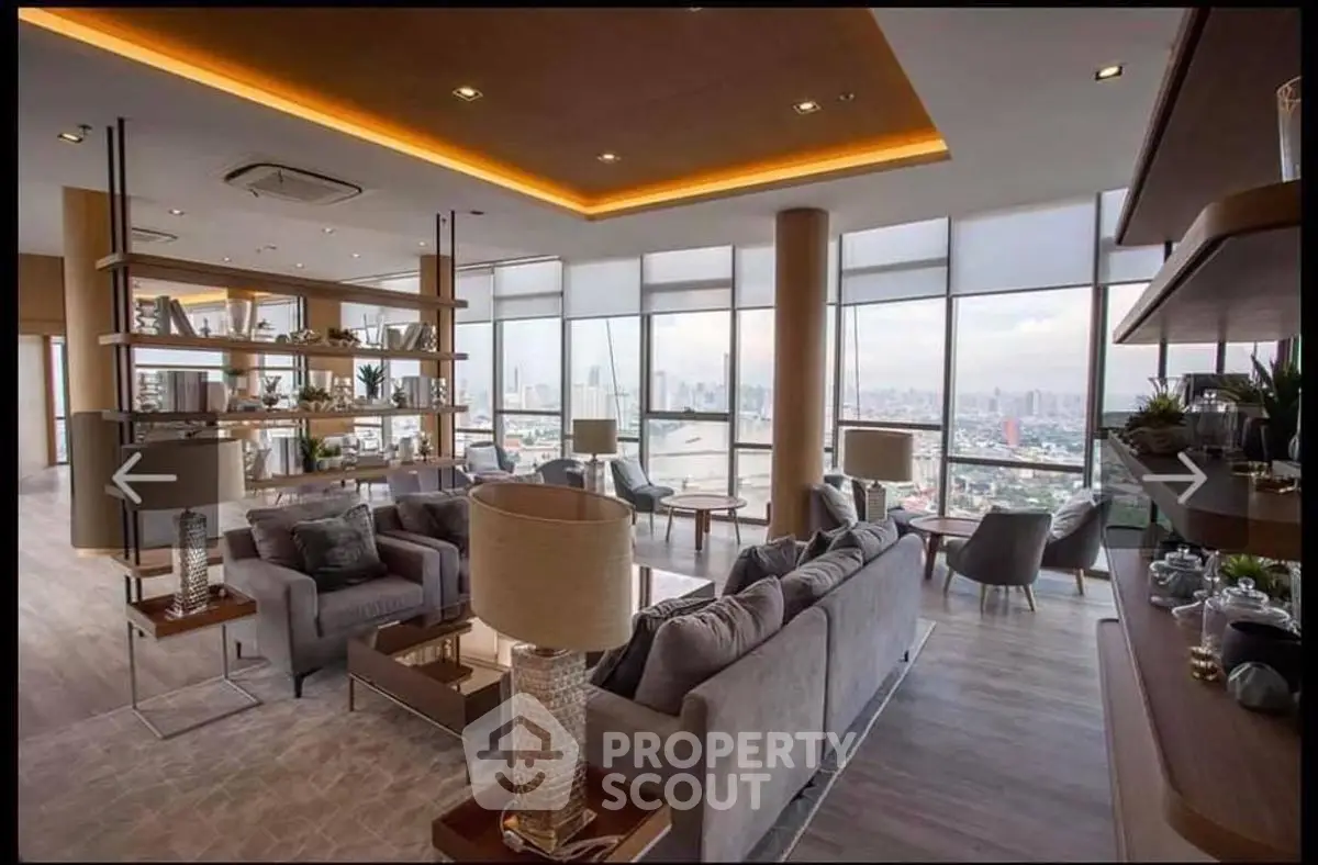 Luxurious modern living room with panoramic city view and elegant decor.
