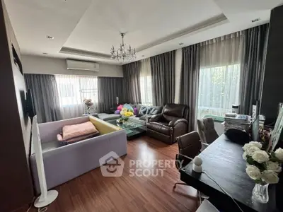 Spacious living room with elegant decor and large windows for natural light.