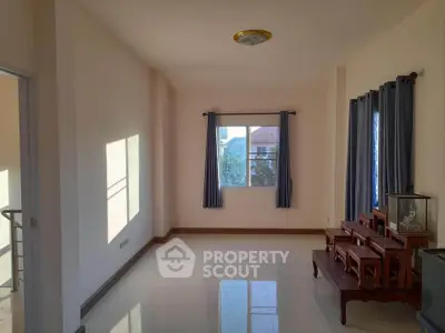 Spacious unfurnished room with large windows and natural light