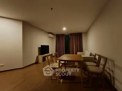 Spacious living room with modern furniture and warm lighting