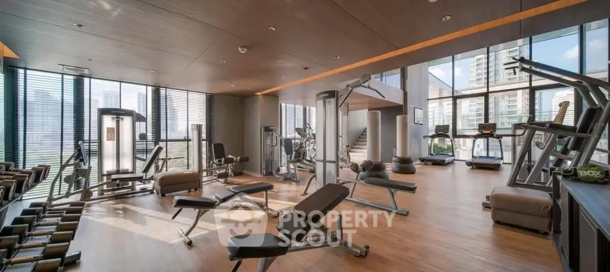 Luxurious high-rise gym with modern equipment and city views