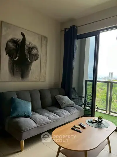 Stylish living room with modern decor and balcony view