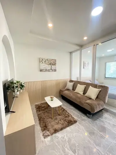 Modern living room with cozy sofa and stylish decor in a bright apartment