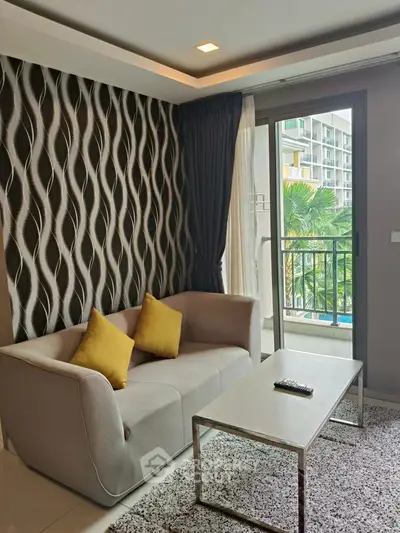 Modern living room with stylish sofa and balcony view in luxury apartment