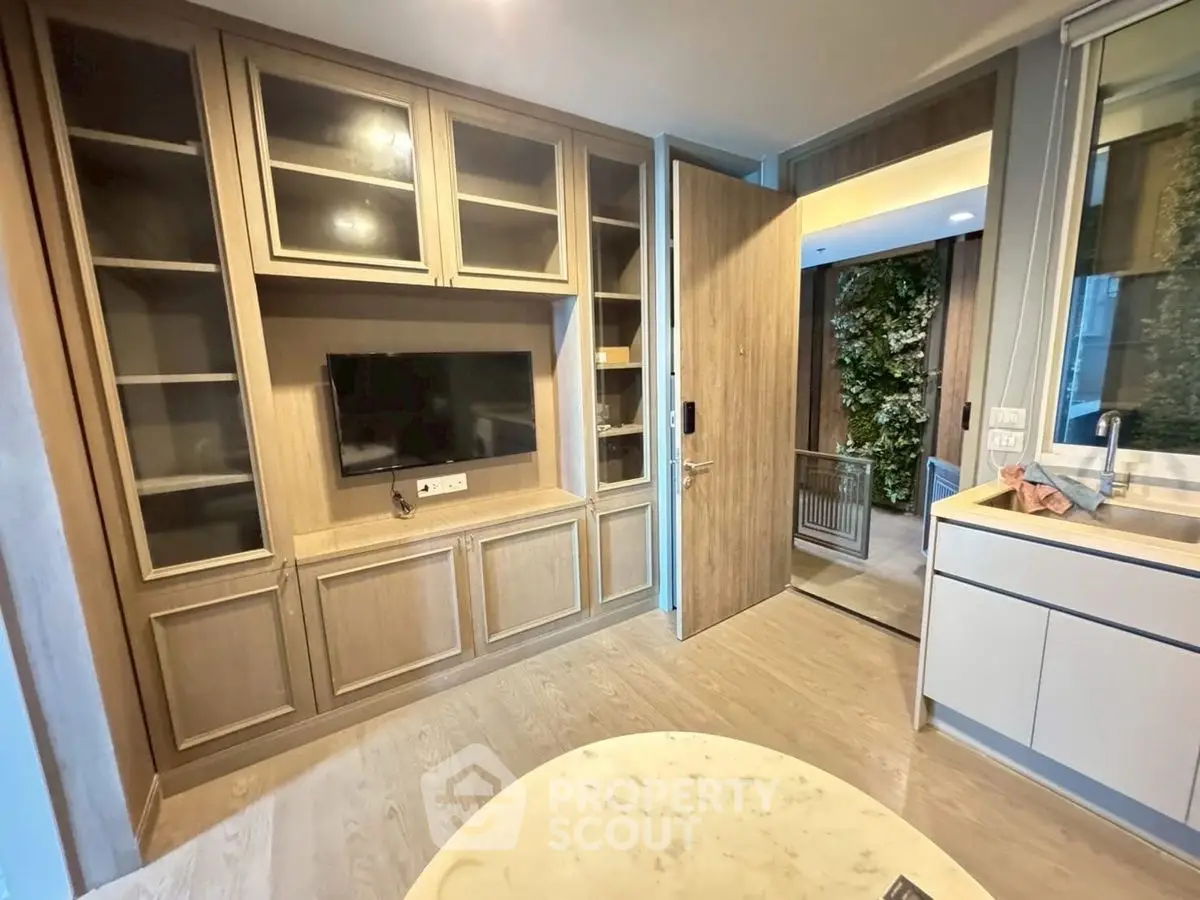 Modern living room with built-in wooden cabinets and sleek TV setup