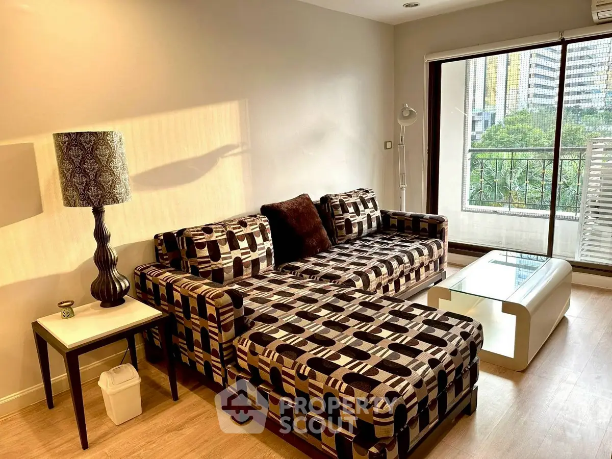 Stylish living room with modern sofa and city view balcony, perfect for urban living.