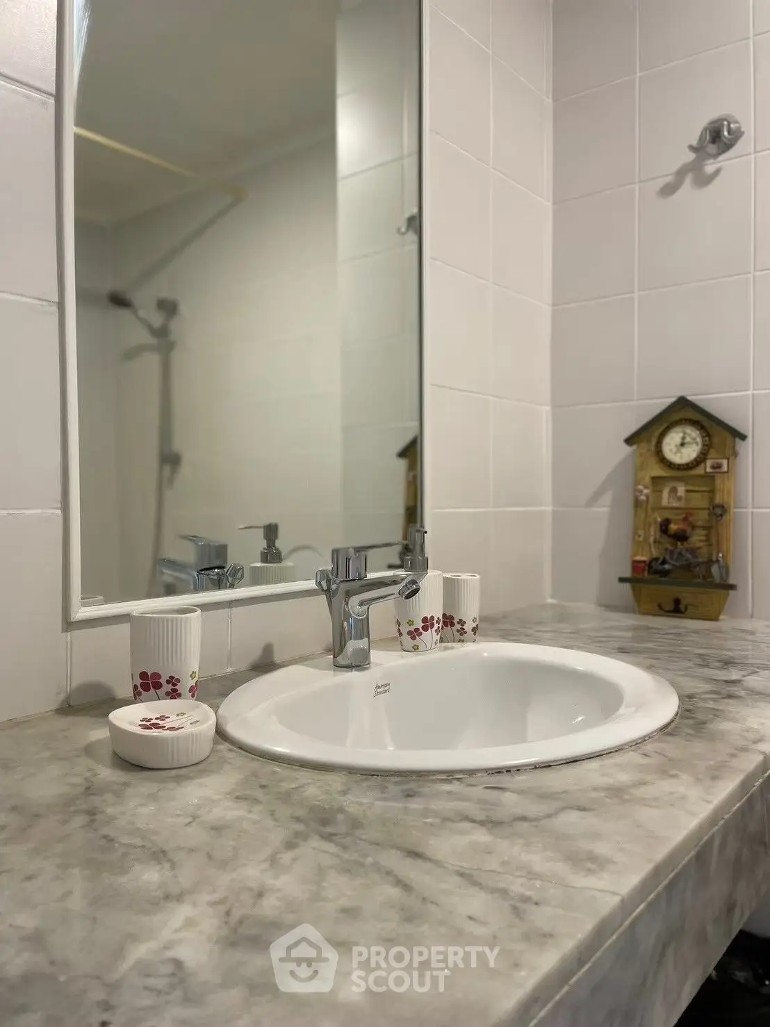 Elegant bathroom with marble countertop and stylish fixtures, perfect for modern living.