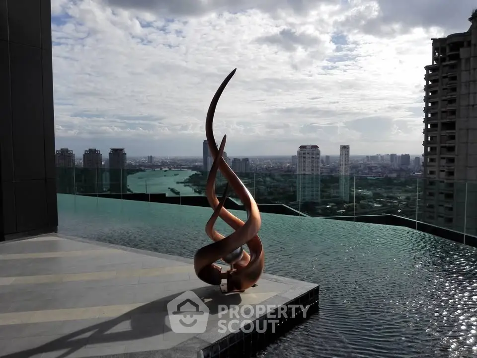 Luxurious rooftop infinity pool with stunning city skyline view and artistic sculpture.