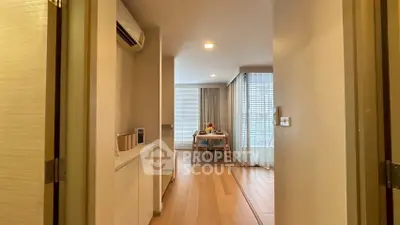 Modern apartment interior with dining area and wooden flooring