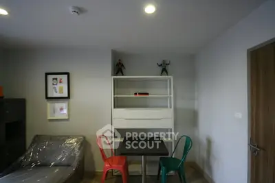 Modern living room with colorful chairs and minimalist decor